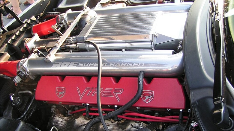 A close view of the Dodge Viper V10 engine installed in a car.