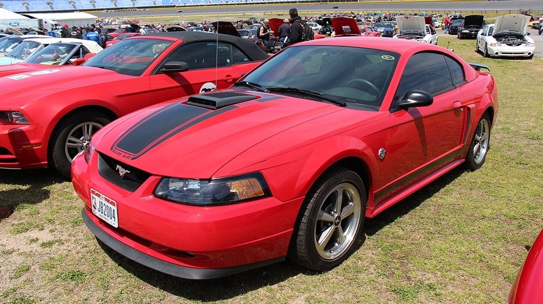A front-quarter shot of a red 2003 Ford Mustang Mach 1