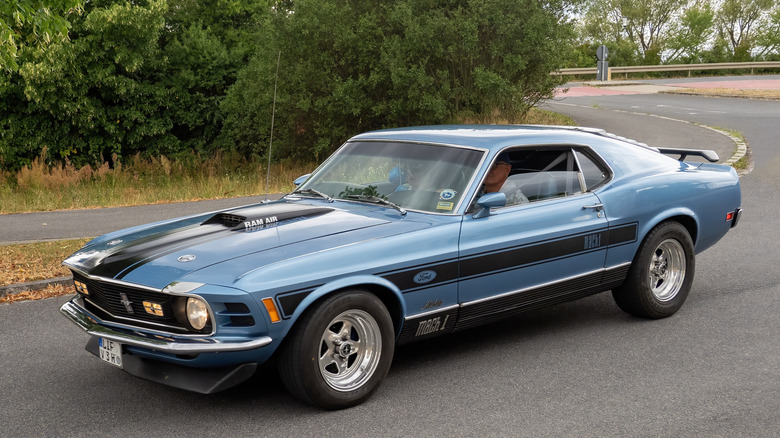 A front-quarter shot of a light blue 1970 Ford Mustang Mach 1