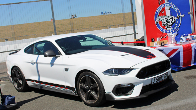A front-right 3/4 of a white 2021 Ford Mustang Mach 1