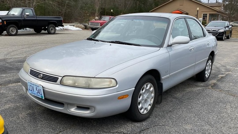 Silver Mazda 626 sedan parked in a lot.