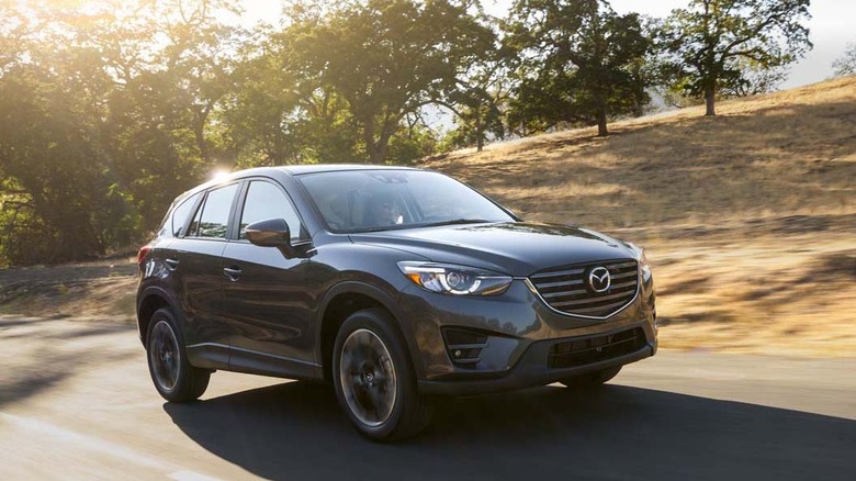 Dark gray 2016 Mazda CX-5 on a rural road.