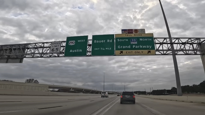 A road sign for Highway 99, Grand Parkway, a Texas toll road that is the only access to the Bridgeland neighborhood near Houston