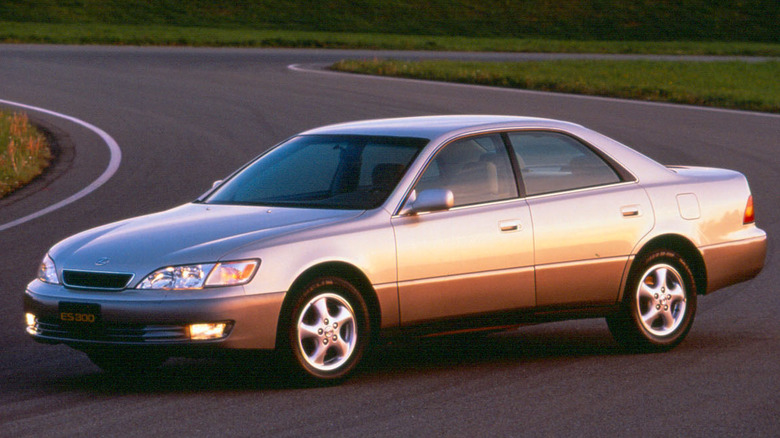A tan 1997 Lexus ES 300 parked across a road.