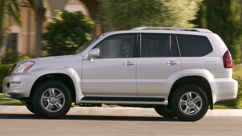 A white 2009 Lexus GX 470 driving on the road.