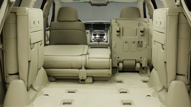 Interior view of a 2008 Lexus LX 570 with the seats folded up to show cargo space.