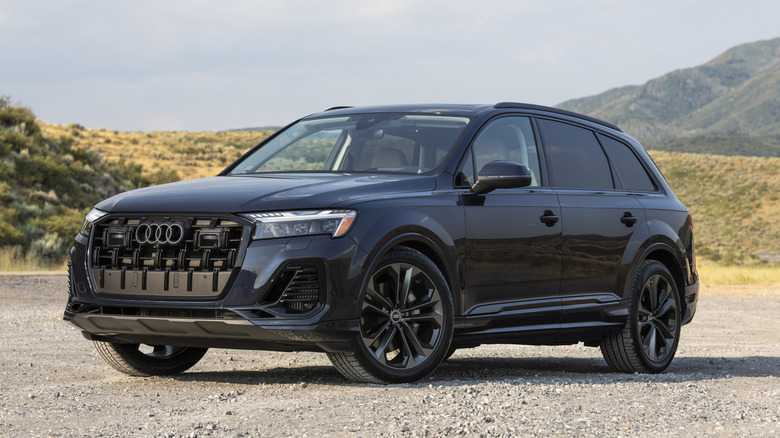 2025 Audi Q7 parked on dirt with mountain in backgroud