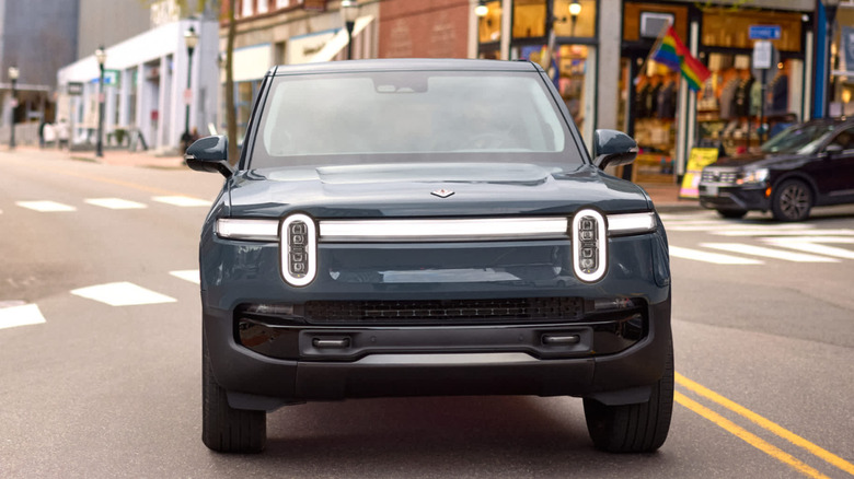 Head-on view of Rivian R1S in a city street.