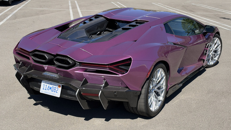 Rear 3/4 view of a pink Lamborghini Revuelto
