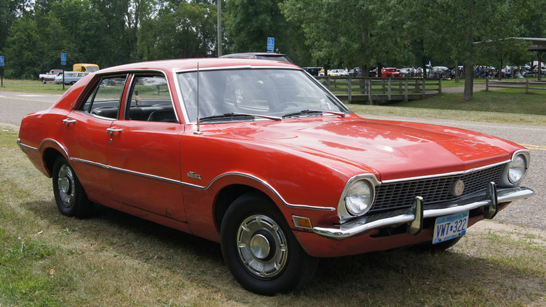 A front 3/4 shot of a red 1972 four-door Ford Maverick