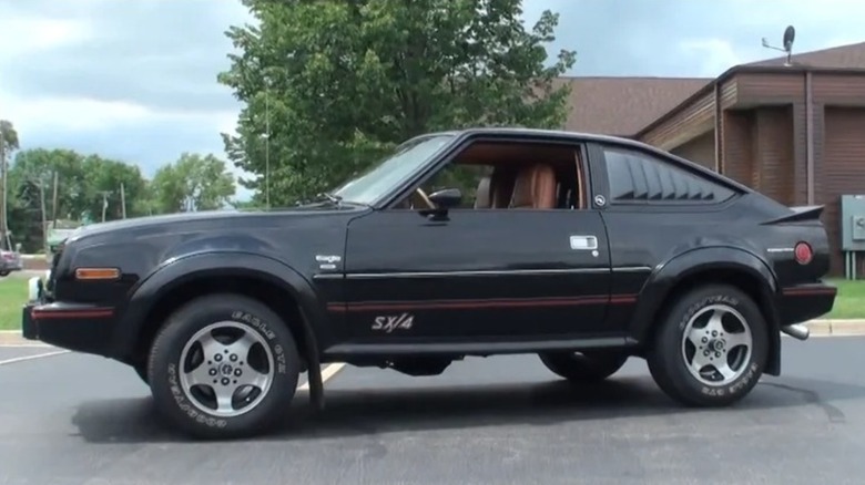 A black AMC Eagle SX/4 in a parking lot.