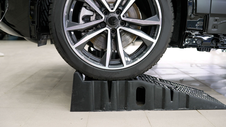A close-up shot of a car positioned on a plastic ramp