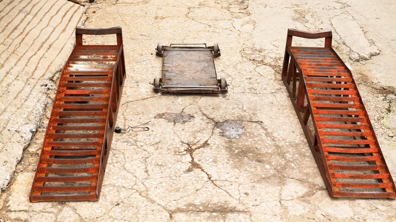 An old set of rusted steel car ramps