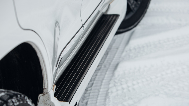 Fixed side steps on a white SUV