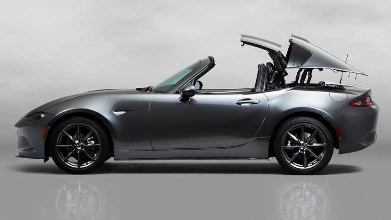 A side shot of a 2017 Mazda Miata RF retracting its roof