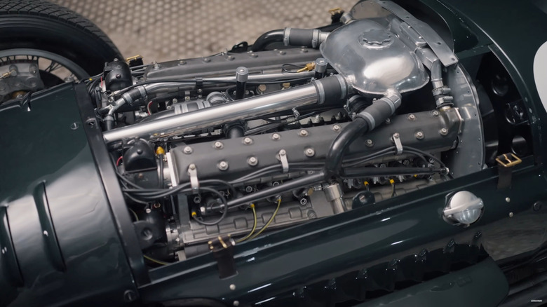 A closeup of the 1.5-liter supercharged V16 in a green BRM Type 15 Formula One race car