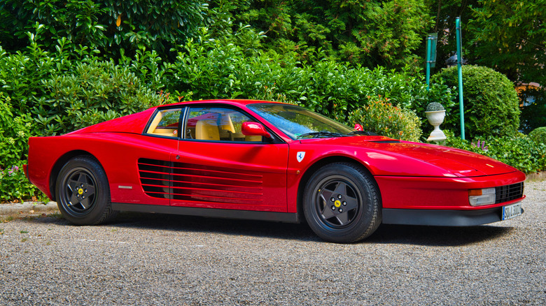 Classic Ferrari Testarossa parked connected a lot.