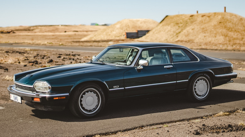 British Racing Green Jaguar XJS parked successful Iceland