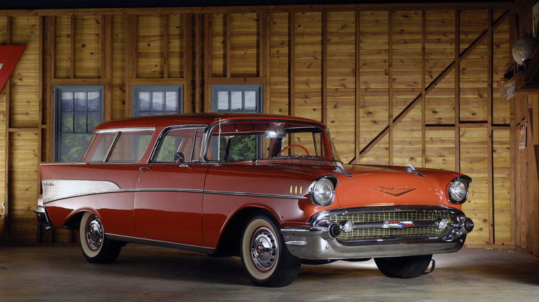 Picture of a red Chevrolet Nomad inside of a wooden barn