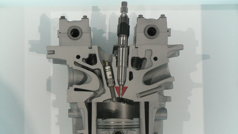 A cutaway image of a direct-injected BMW engine