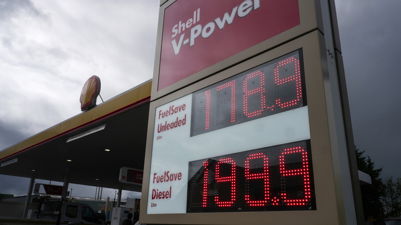An electronic board showing gas prices at a Shell gas station