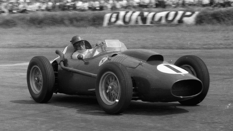 Peter Collins driving a Ferrari Dino 246 racecar at the British Grand Prix in 1958