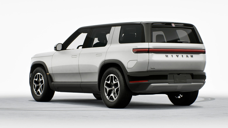 Rear 3/4 of a Rivian R2 Standard in Glacier White.