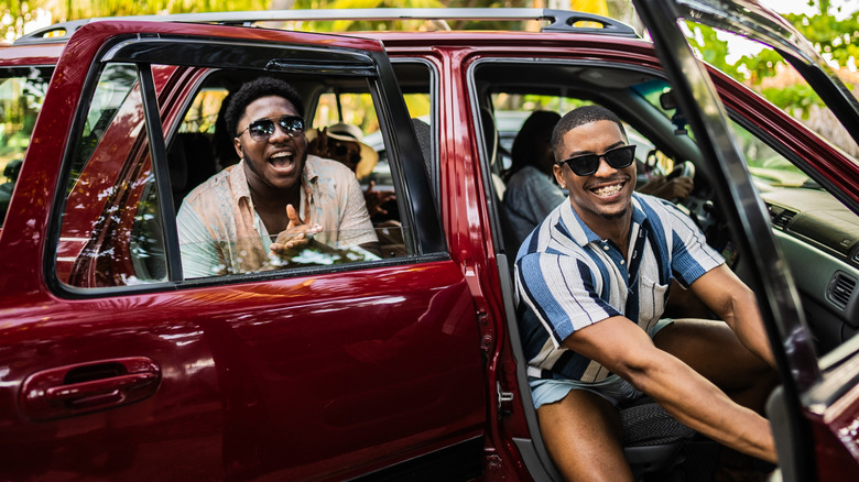 A group of friends getting out of a car