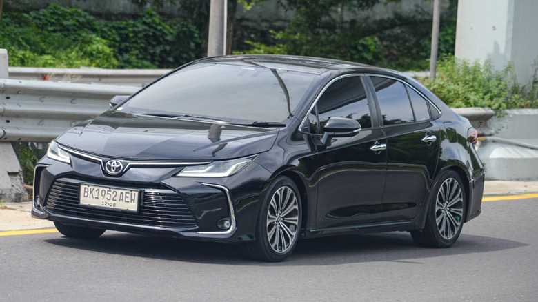 A well-maintained black Toyota Corolla