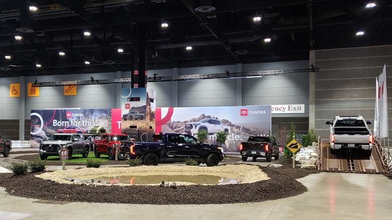 An indoor test track shows offroad capabilities.