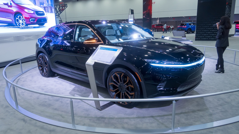 A concept car is displayed behind a barrier.