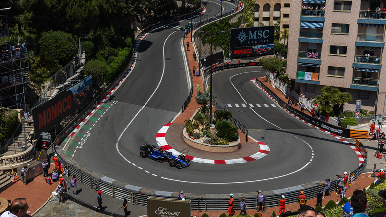 The famous hairpin curve from the Monaco Circuit with a single race car on the track.