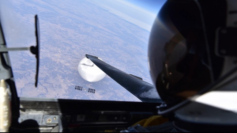 A U-2 monitors a Chinese spy balloon over American airspace