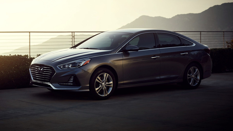 A Hyundai Sonata on a misty mountain road