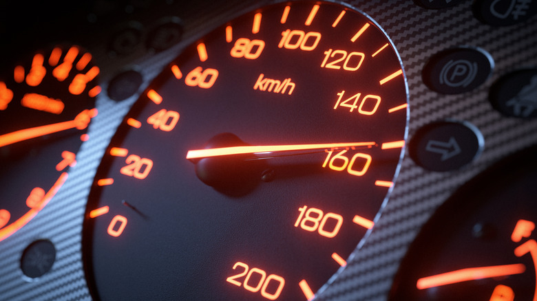 Close-up of a speedometer hitting 160 kph