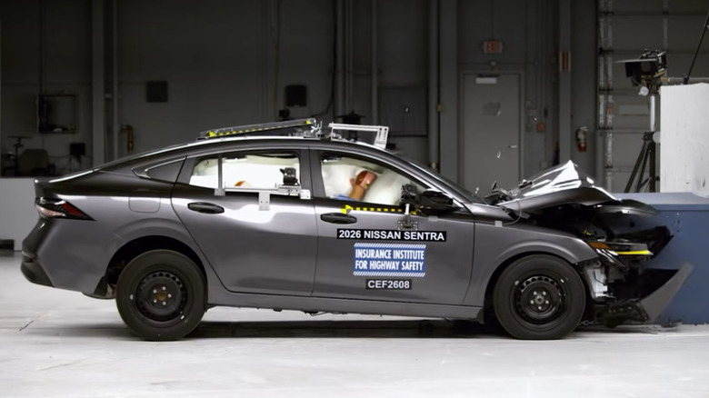 The passenger-side profile of 2026 Nissan Sentra during IIHS's front-overlap test