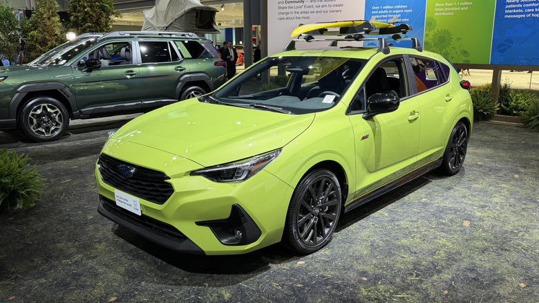 Front 3/4 view of a green Subaru Impreza at the New York Auto Show
