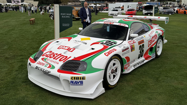 Front 3/4 view of a Toyota Supra race car with a red and green Castrol livery.