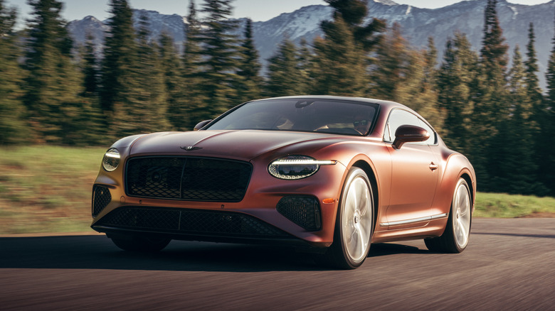 Front 3/4 view of a satin red Bentley Continental GT coupe