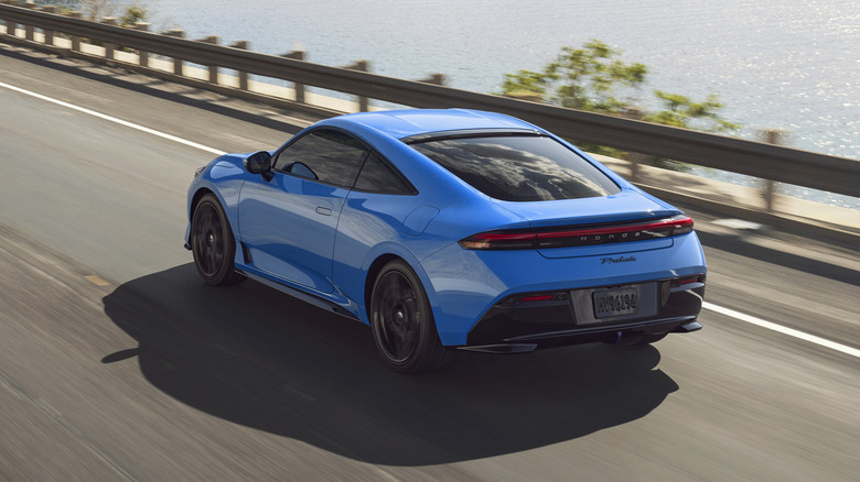 Rear 3/4 view of a blue Honda Prelude
