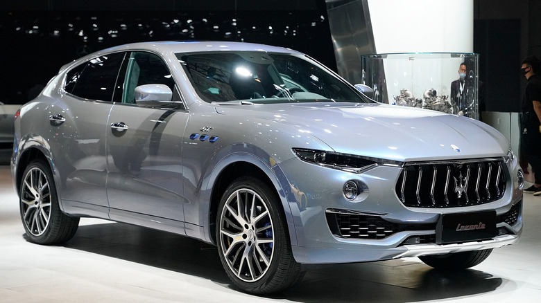 A gray Maserati Levante at an auto show.