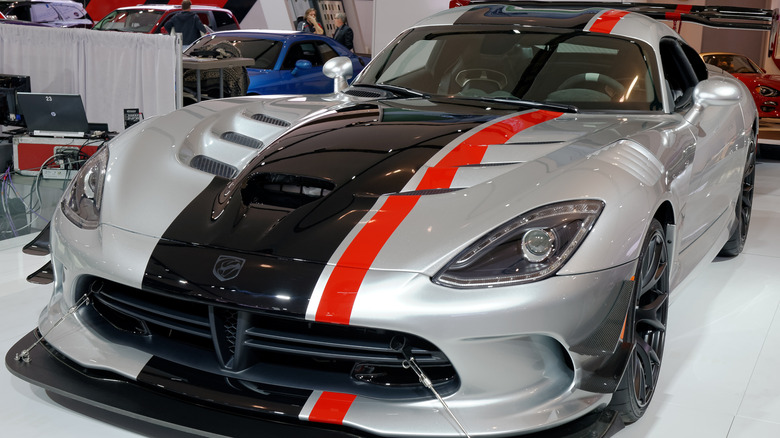 A silver with black and red stripping 2016 Dodge Viper ACR being shown at the Canadian International AutoShow.