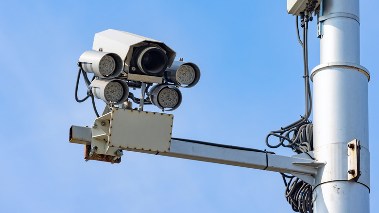 A traffic camera on a light pole.