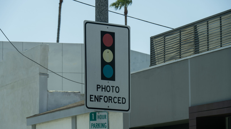 A sign that indicates that an intersection has a photo-enforced stoplight.