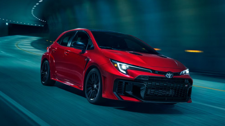A red 2026 GR Corolla driving through a tunnel