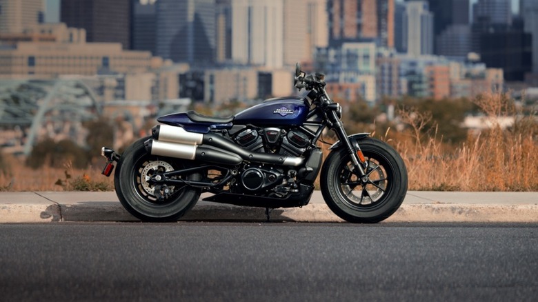 2025 Harley-Davidson Sportser S Parked on a sidewalk in front of a cityscape