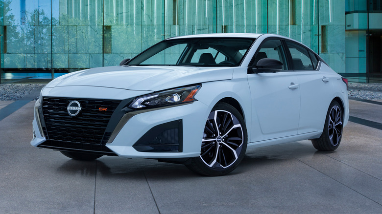 Front 3/4 static shot of a white Nissan Altima