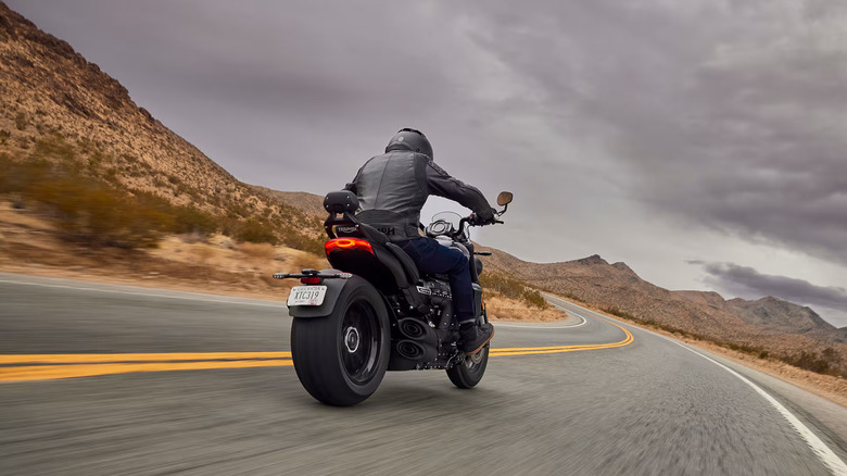 Triumph Rocket 3 GT riding away in the desert
