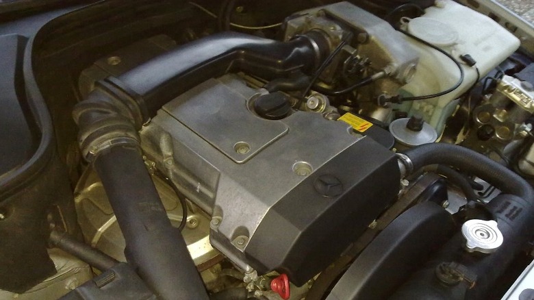 An under-hood shot of Mercedes-Benz M111 engine