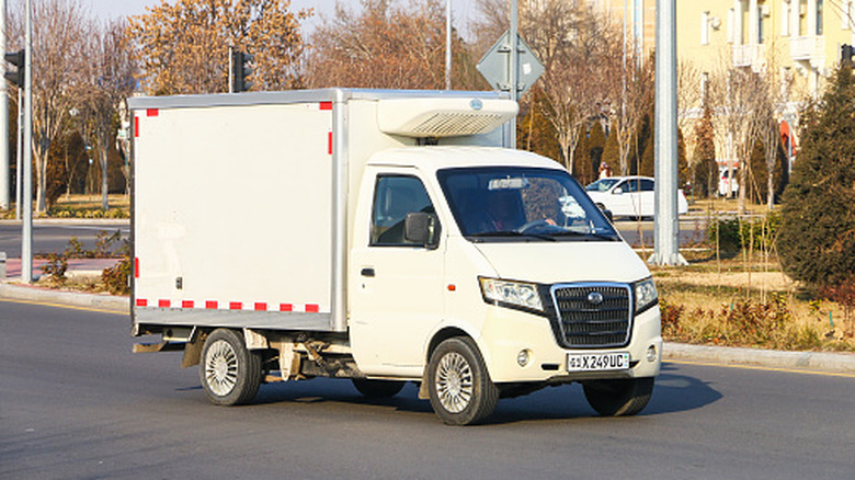 A refrigerated truck sits parked.